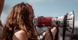 female protester with megaphone