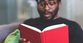 student or professor reading a book